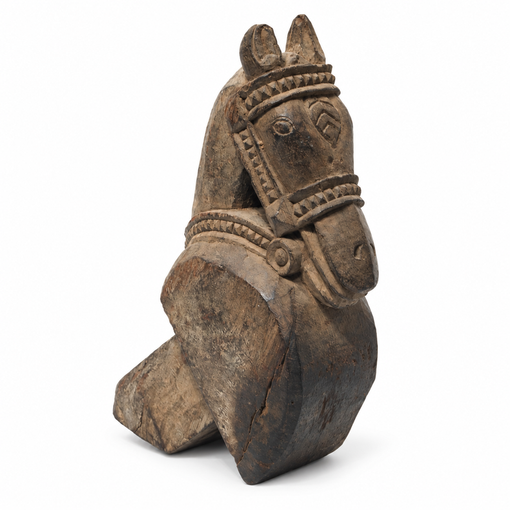 Side view of the antique carved wooden horse table accent on white. hoWme