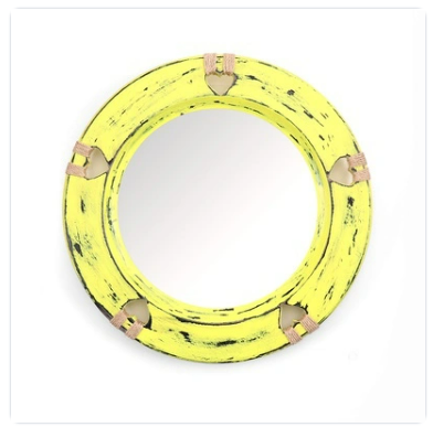 Antique yellow circular wooden wall mirror