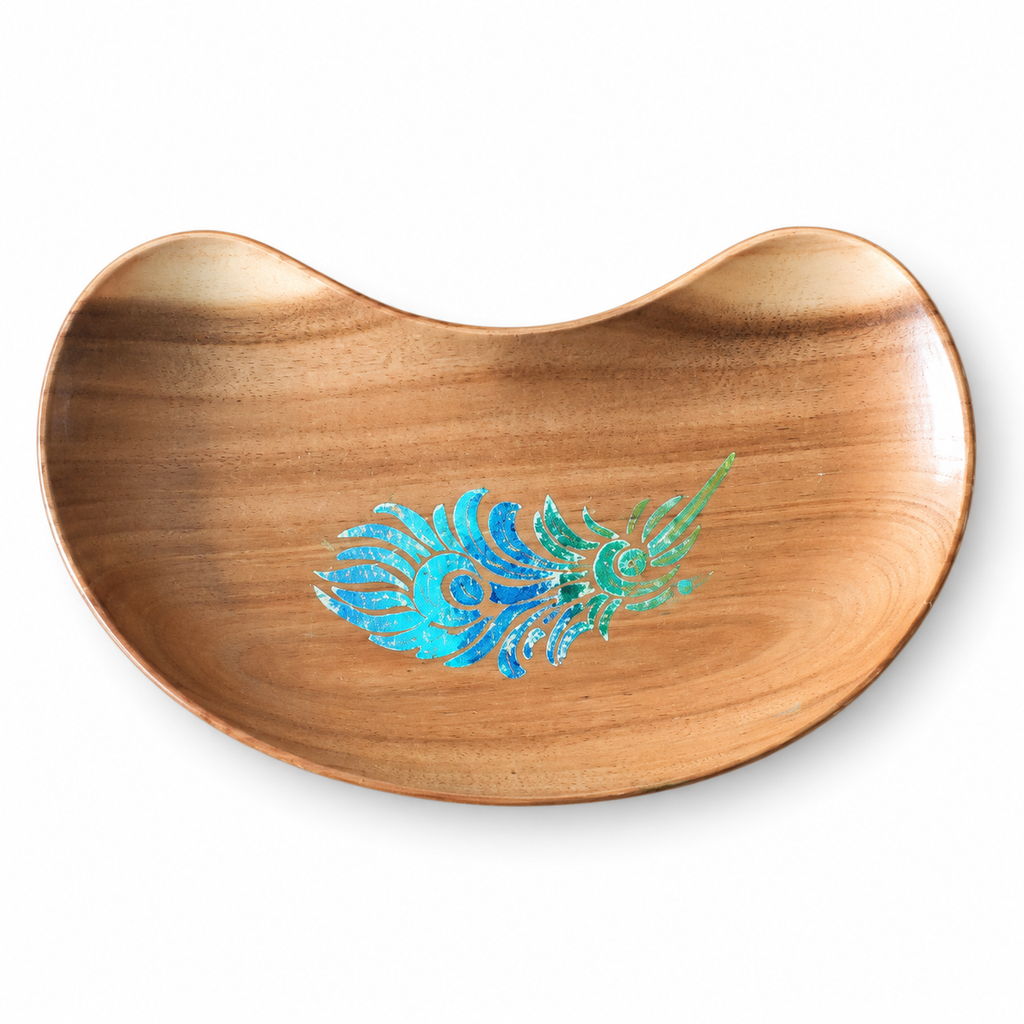 Bean-shaped wooden tray with blue-green peacock feather motif on a white background. hoWme