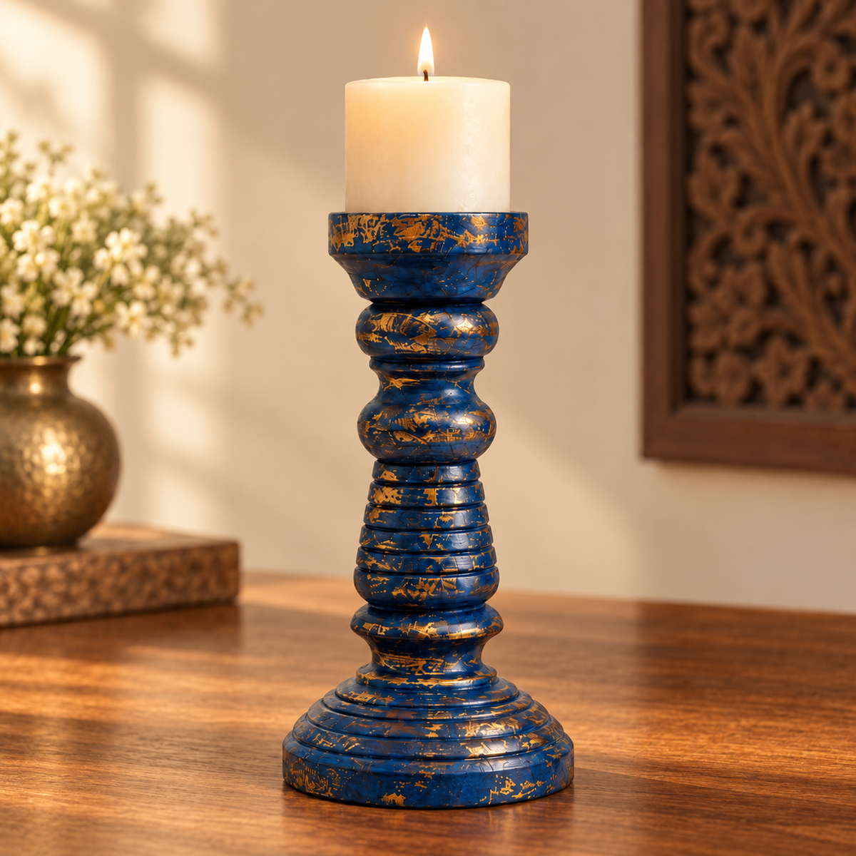 Blue and gold wooden candlestand in a tabletop setting. hoWme