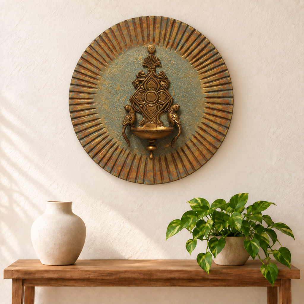 Blue and gold wooden wall plate with brass diya styled above a console – hoWme