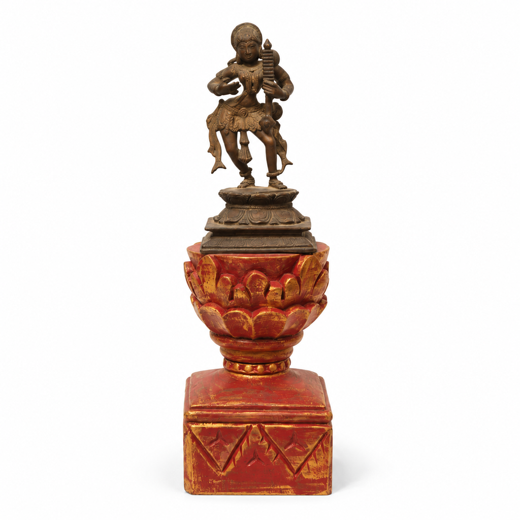 Brass dancing artefact on a red and gold wooden pedestal, tabletop decor. hoWme