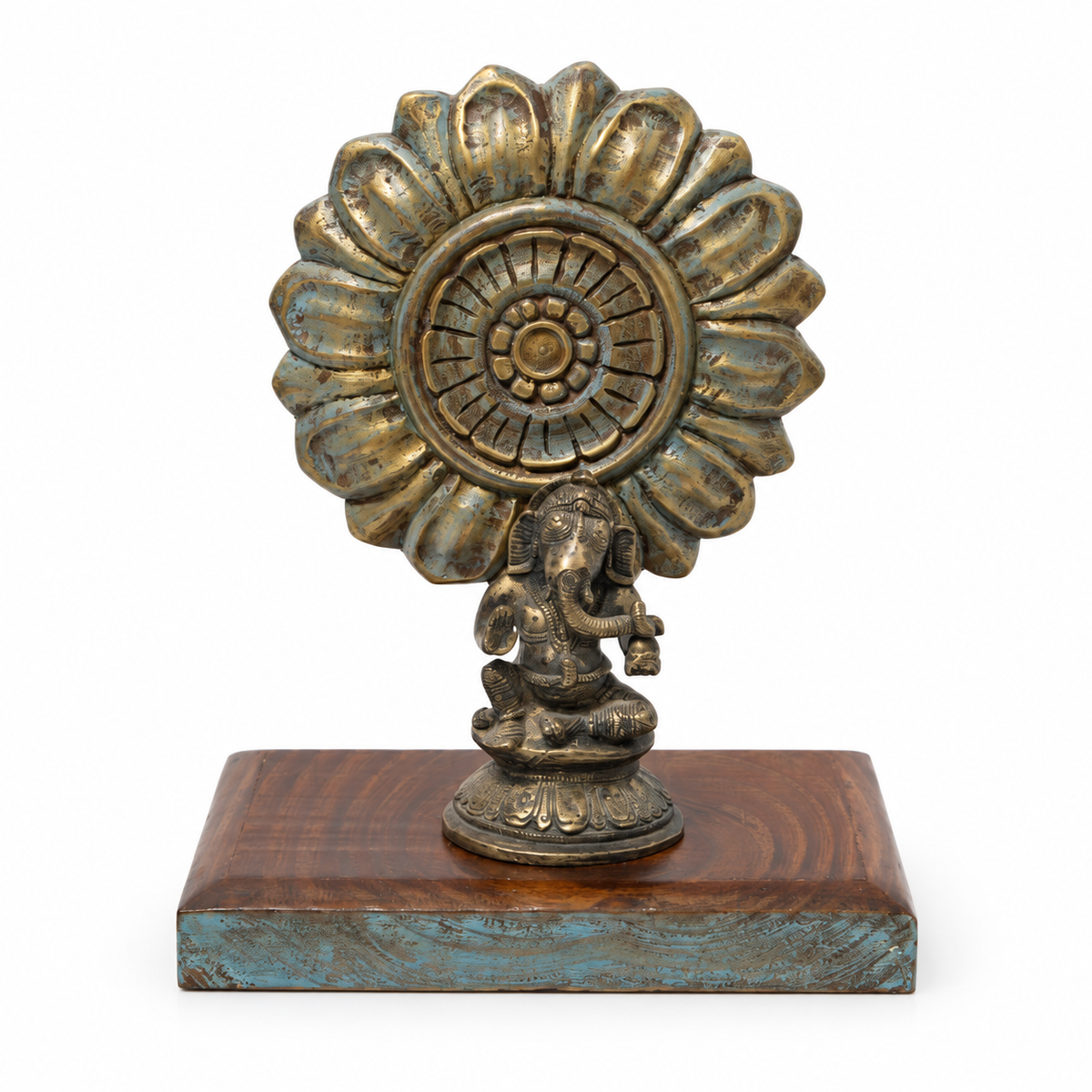 Brass Ganesha and carved sunburst on a blue and brown wooden base, front view. hoWme
