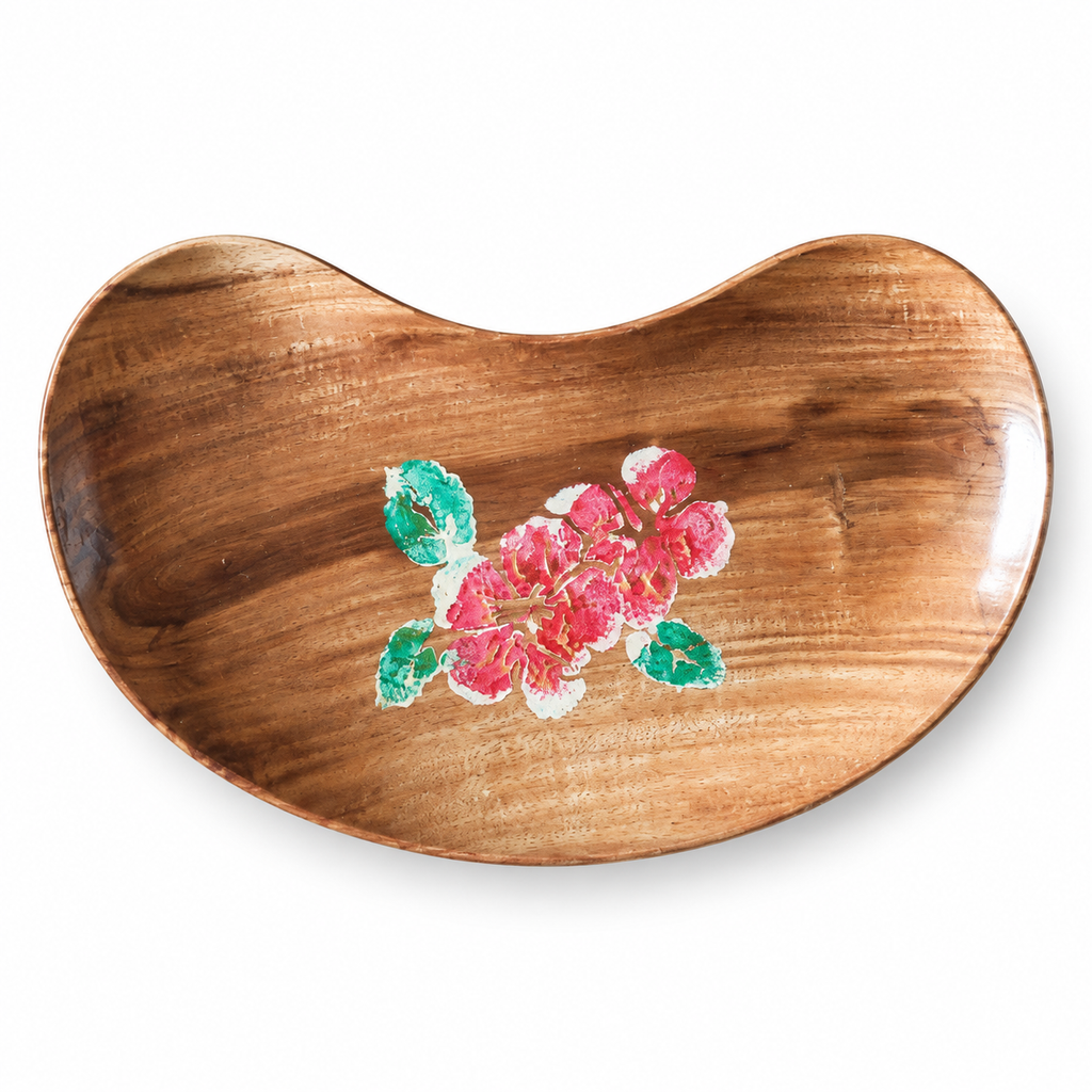 Brown bean-shaped wooden tray with pink floral detail on a white background. hoWme