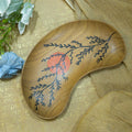 Brown botanical wooden serving tray styled with blue flowers and gold fabric hoWme