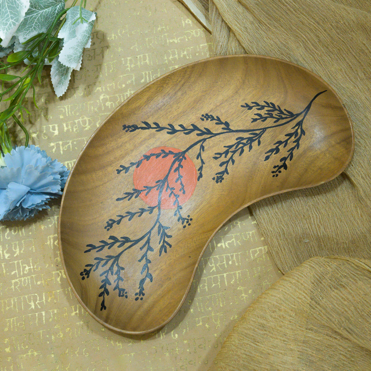 Brown botanical wooden serving tray styled with blue flowers and gold fabric hoWme