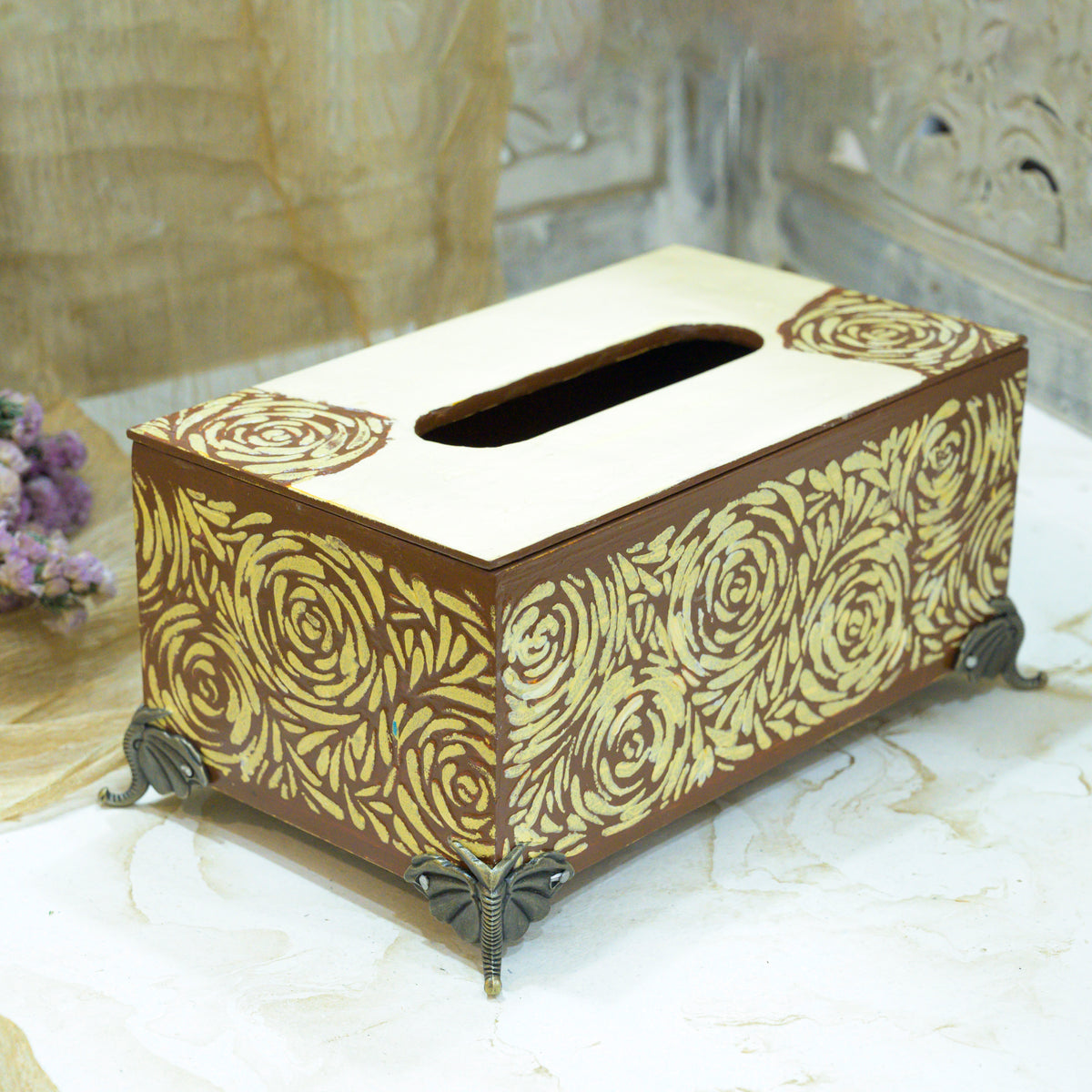 Angled view of brown and off-white floral MDF tissue holder with brass feet – hoWme