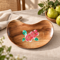 Brown wooden tray with pink floral detail styled with fruit and linen. hoWme