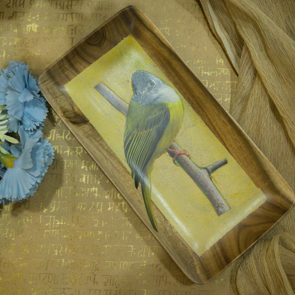 Brown and yellow bird print wooden serving tray styled with blue flowers hoWme