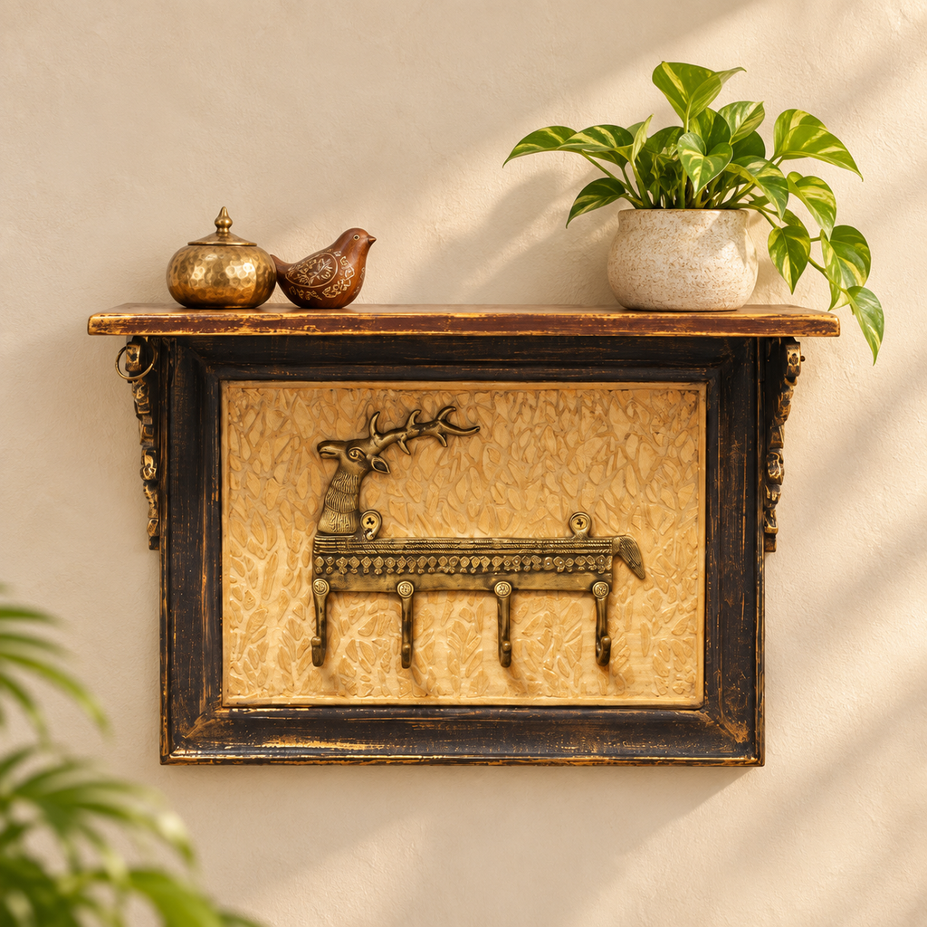 Deer motif wall shelf styled with a planter and brass accents on an ivory wall. hoWme