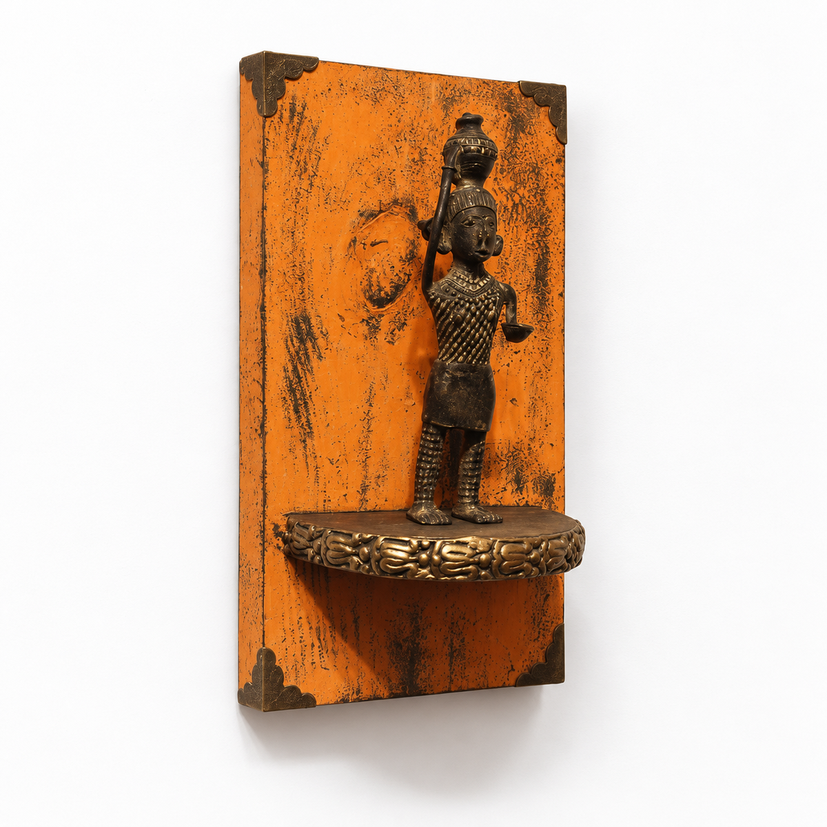 Orange wooden wall panel with brass figurine and small display ledge, hoWme.
