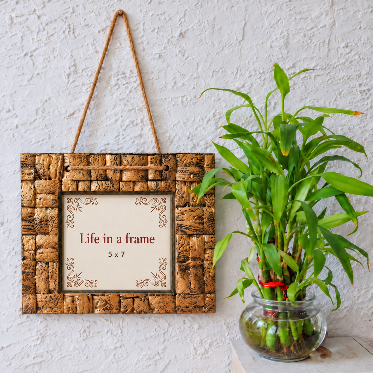 Golden handcrafted wooden photo frame styled with a plant for wall décor – hoWme