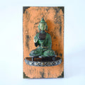 Brass Buddha artefact mounted on a handcrafted wooden block for wall décor – hoWme