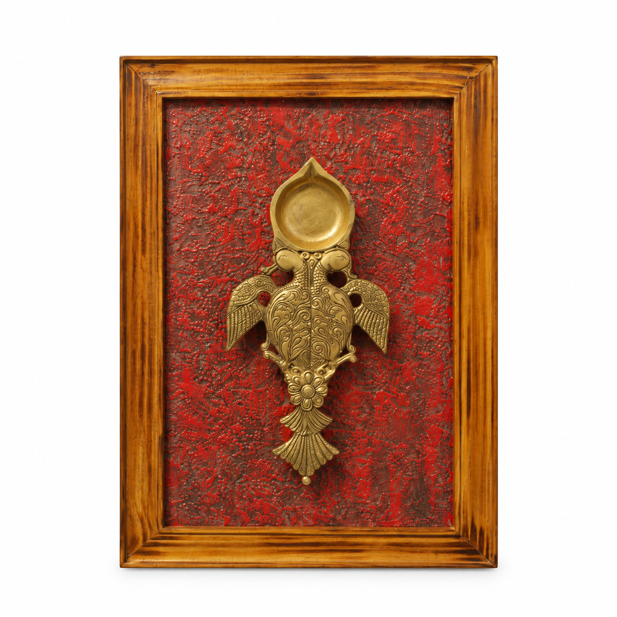 Handcrafted framed brass aarti diya on maroon backdrop – front view for wall décor – hoWme