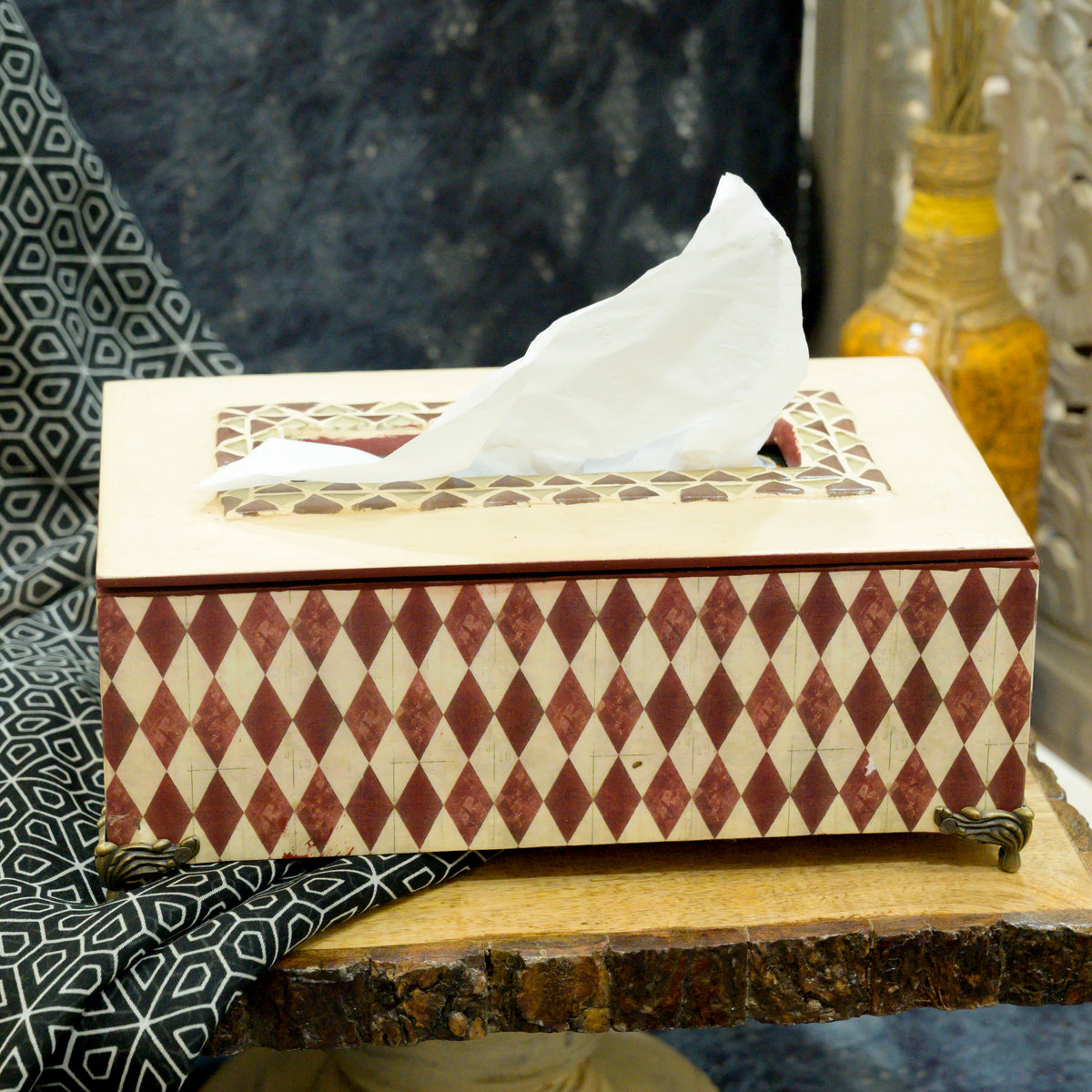 Red geometric mosaic decoupage MDF tissue holder with brass feet on a wooden table – hoWme