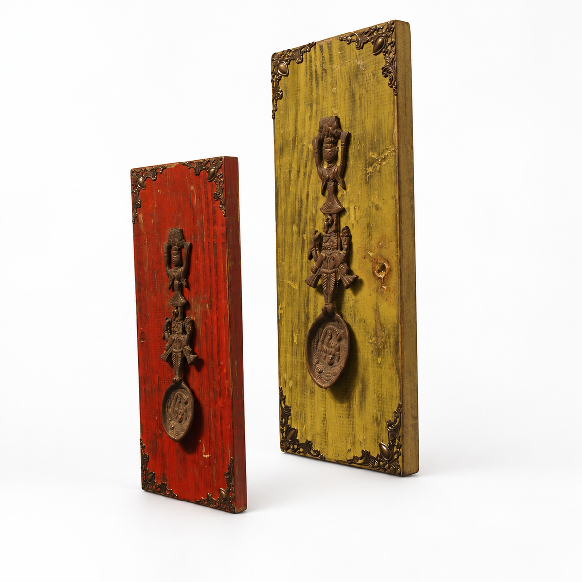 Angled view of red and yellow wooden wall panels with brass artefacts. hoWme